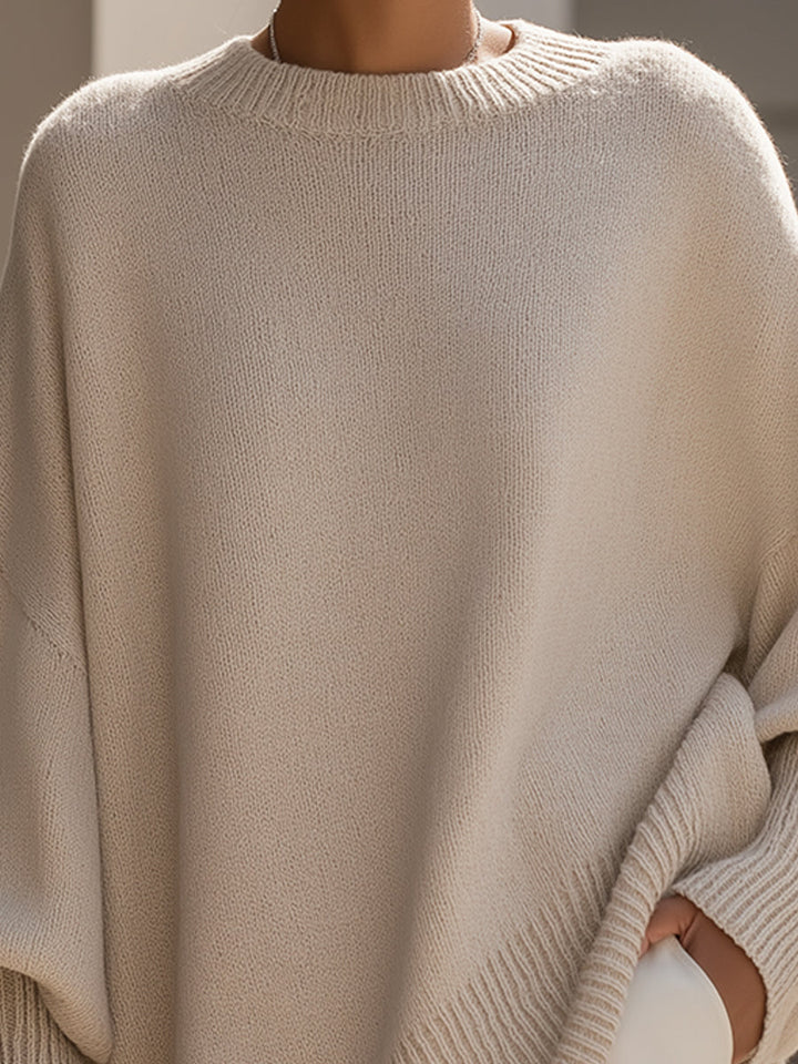 Beige wool-blend oversized jumper, close-up of crew neck and knit texture