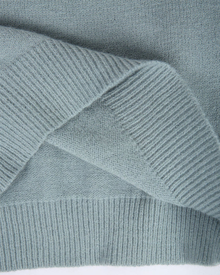 Light blue knit fabric with ribbed hem and fine vertical stitch texture