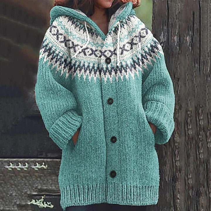 Light teal knit hooded button-front vest with patterned yoke and ribbed hem