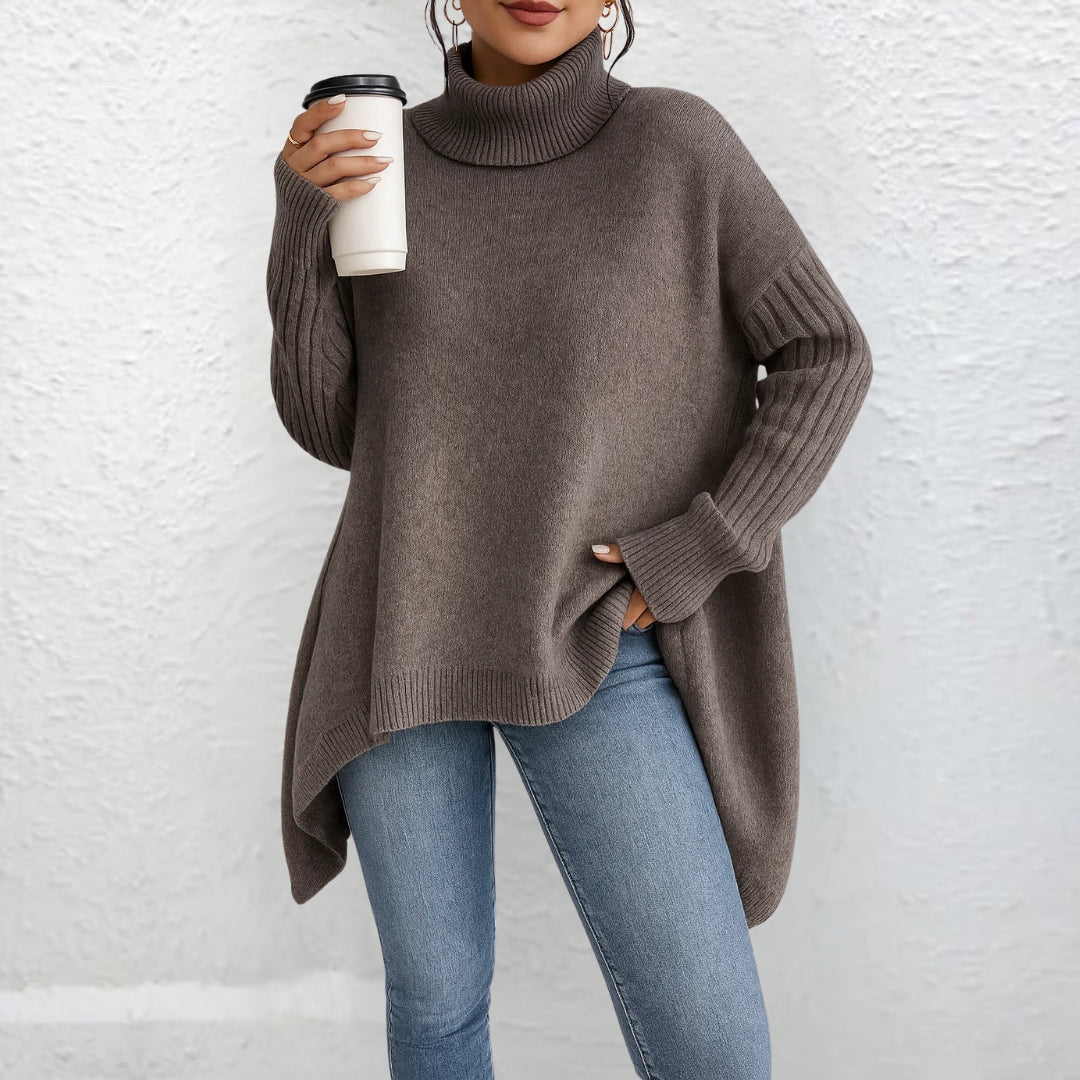 Brown turtleneck sweater with long sleeves and ribbed cuffs, asymmetrical hem.