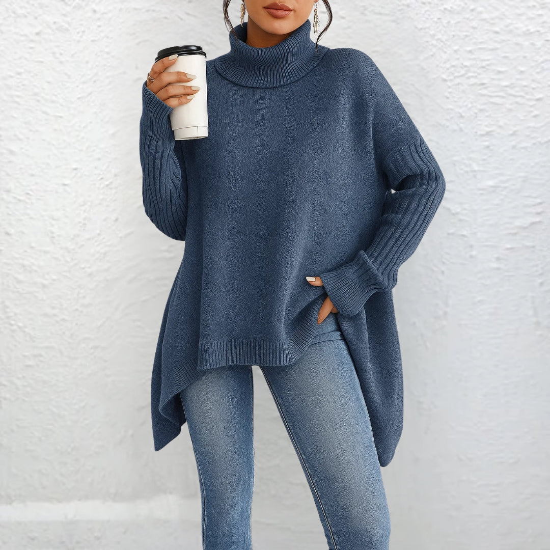 Blue turtleneck sweater with long sleeves and ribbed cuffs, loose fit.
