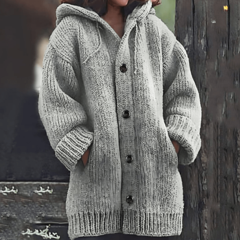Light gray hooded knit vest with button front and ribbed cuffs and hem
