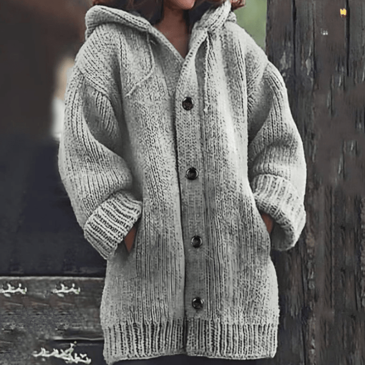 Light gray hooded knit vest with button front and ribbed cuffs and hem