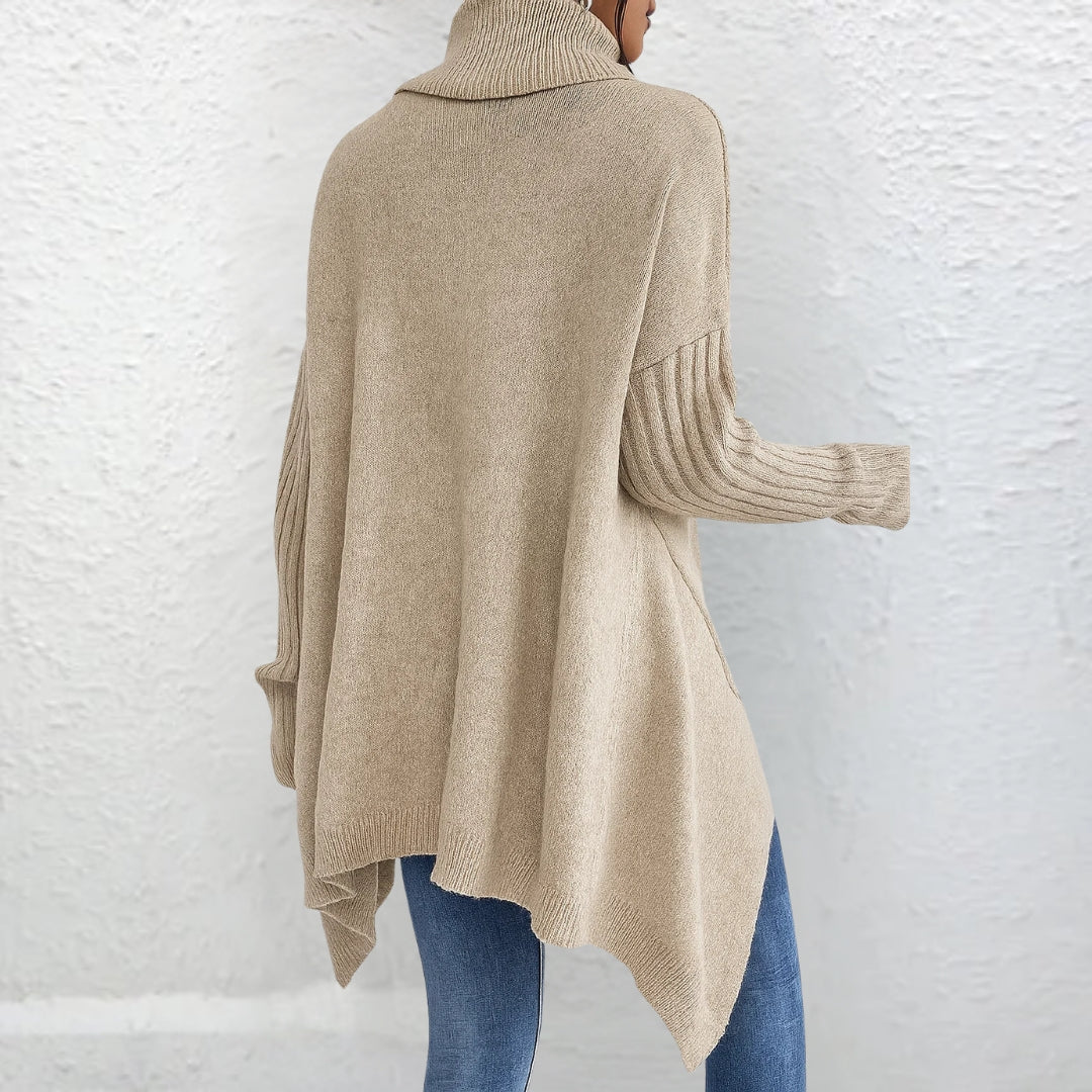 Beige back view turtleneck sweater with long sleeves and ribbed cuffs, asymmetrical hem.