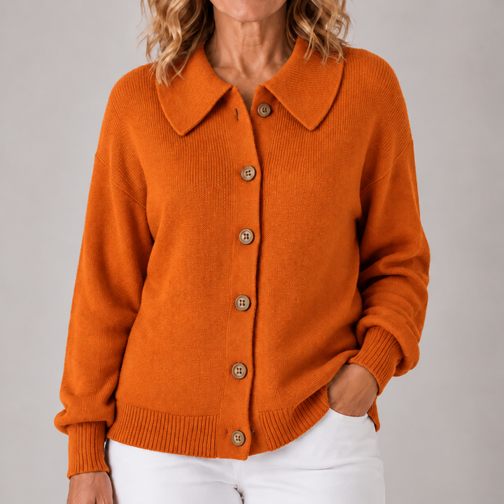 Orange collared knit cardigan with button front, long sleeves, ribbed cuffs and hem