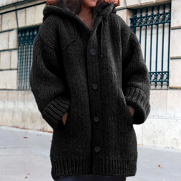 Black hooded knit vest with button front and ribbed cuffs and hem