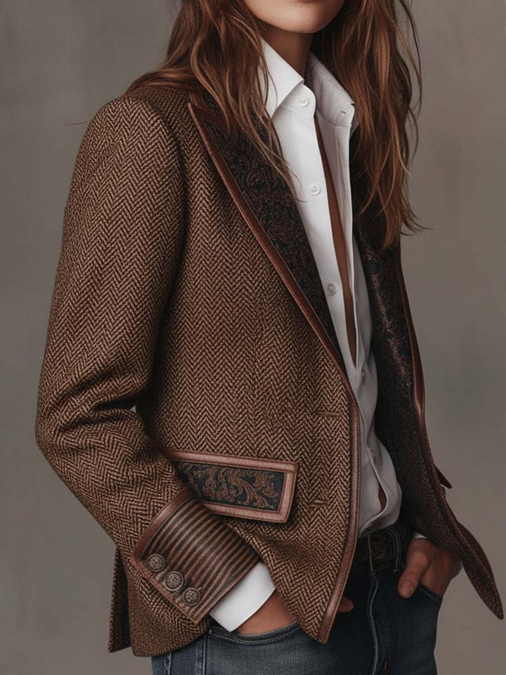 Brown herringbone tweed blazer with dark printed pocket trim and elbow-length sleeves