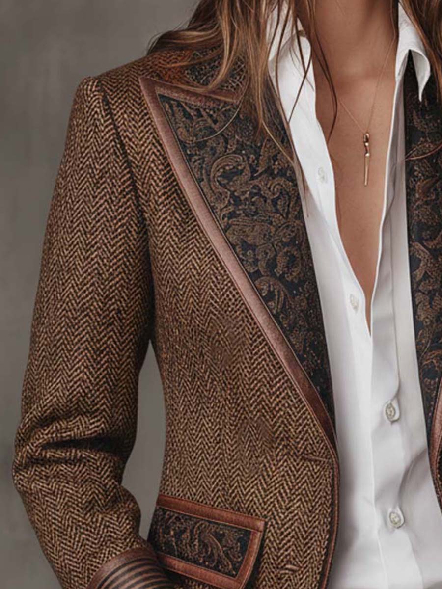 Brown herringbone tweed blazer front with dark ornate printed panel and trim edging