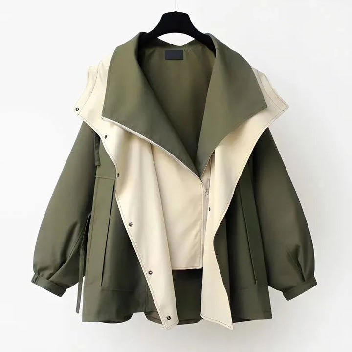 Two-tone hooded windbreaker jacket in olive green with white front panel.