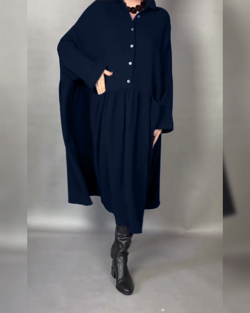 A-line button-collar dress in dark navy, long sleeves, front button placket, pleats