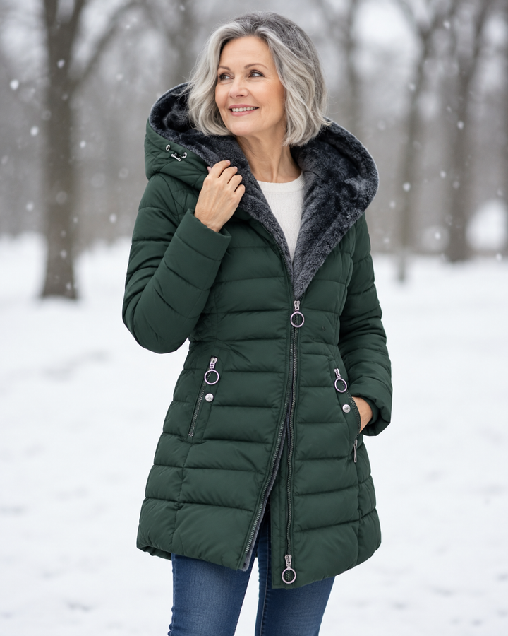 Women's winter coat with hood, dark green quilted shell, faux-fur trim, front zipper.