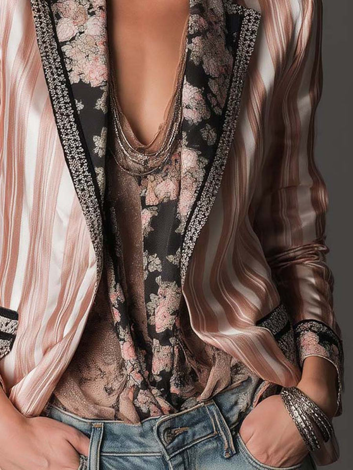 Pink satin-striped blazer sleeve and side with black trim and patterned interior lining