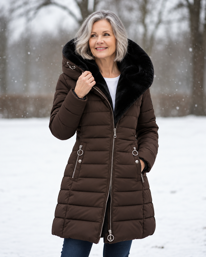 Women's winter coat with hood, brown quilted puffer, black faux-fur hood trim, zipper front.