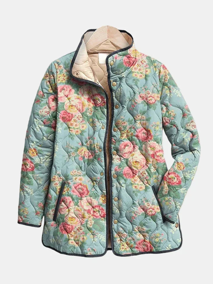 Ainsley™ quilted floral print jacket front, teal with pink flowers, snap placket