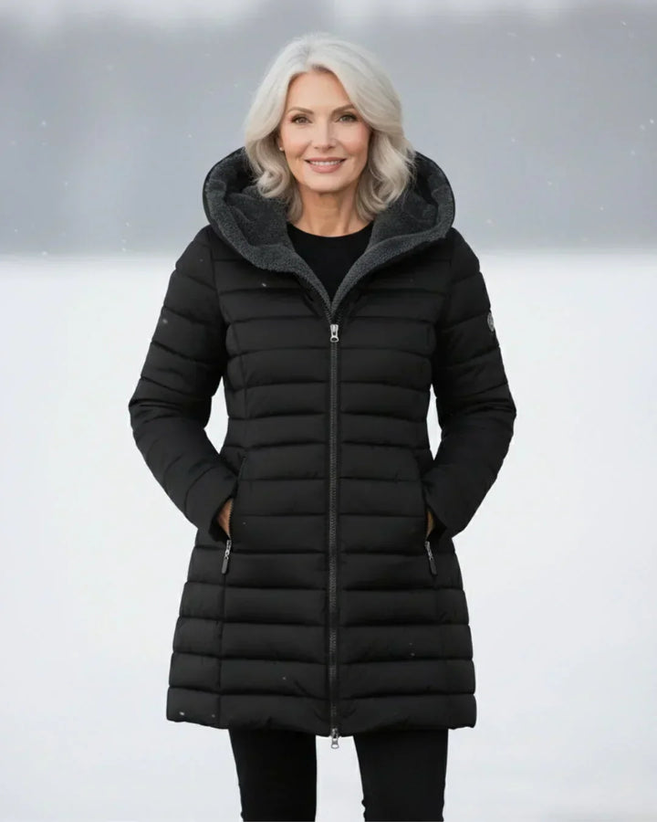 Black padded winter jacket with gray hood lining, front zipper, side pockets.