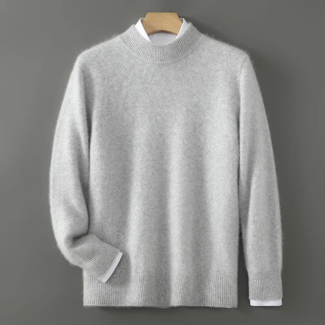 Light cream cashmere crewneck sweater with ribbed hem, cuffs, and neckline