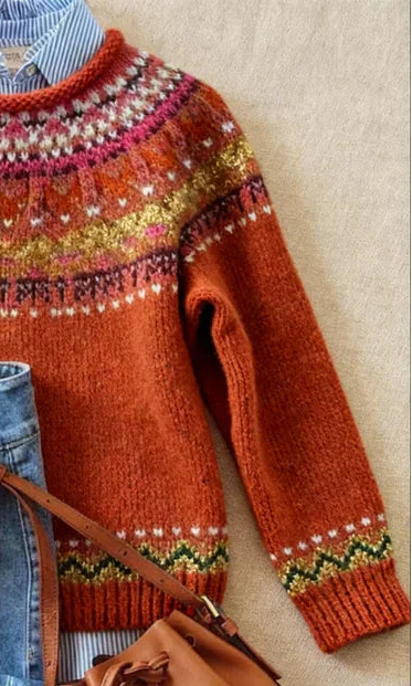 Rust orange knit jumper sleeves with green and pink fair-isle stripe cuffs