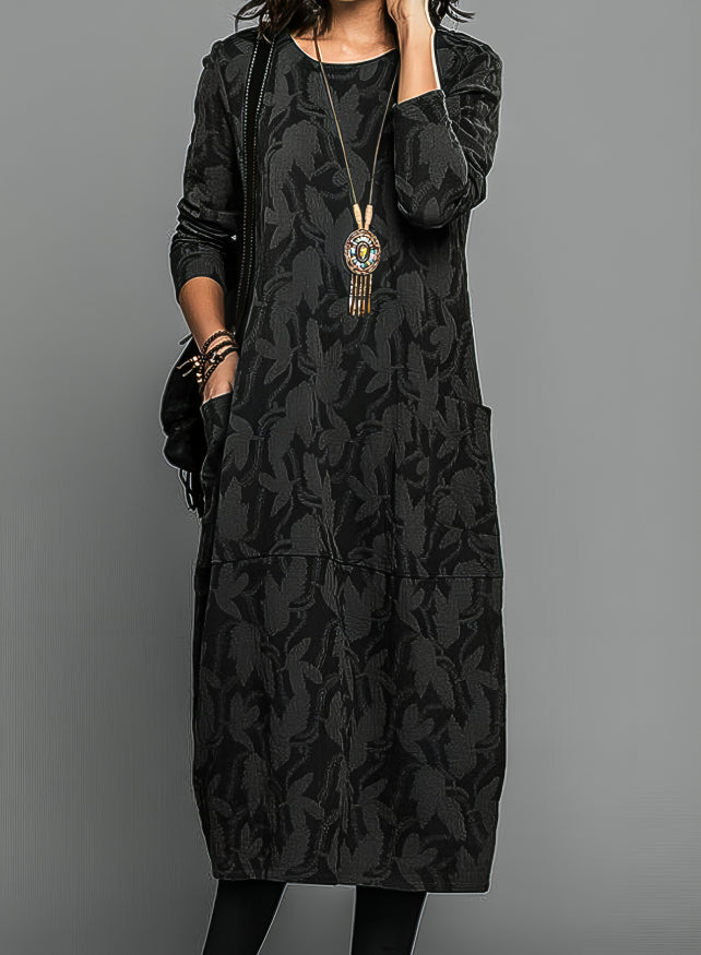 Black knit midi dress with tonal vine pattern and waist belt, long sleeves