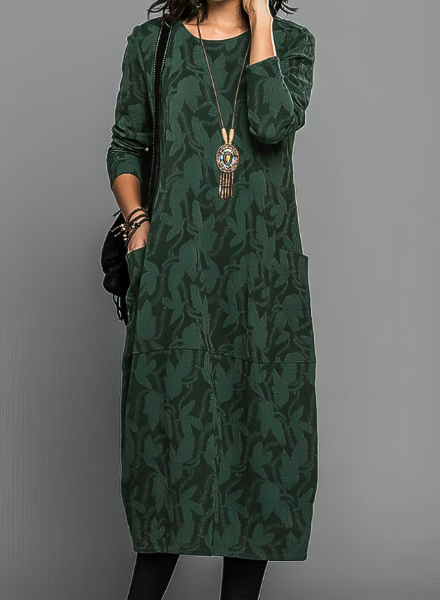 Green knit midi dress with tonal vine pattern and waist belt, long sleeves
