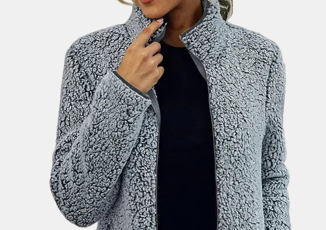 Grey teddy jacket with stand collar, full zipper, model wearing with dark top