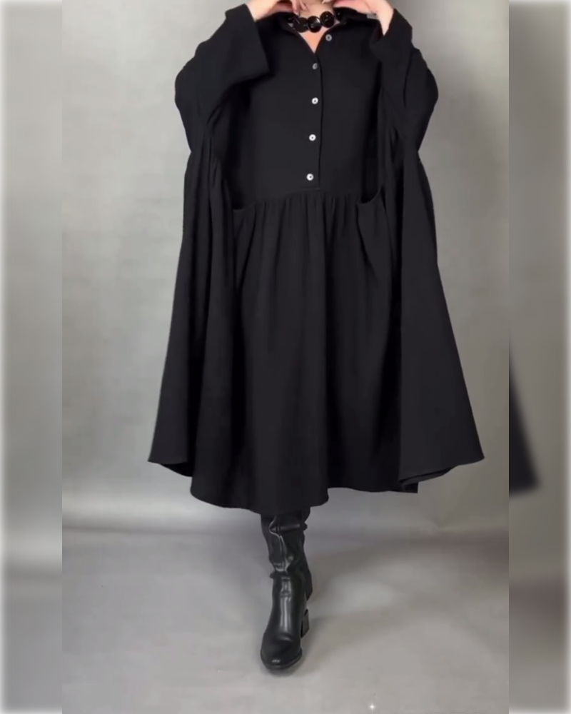 Black button collar A-line dress with long sleeves and gathered skirt panel.
