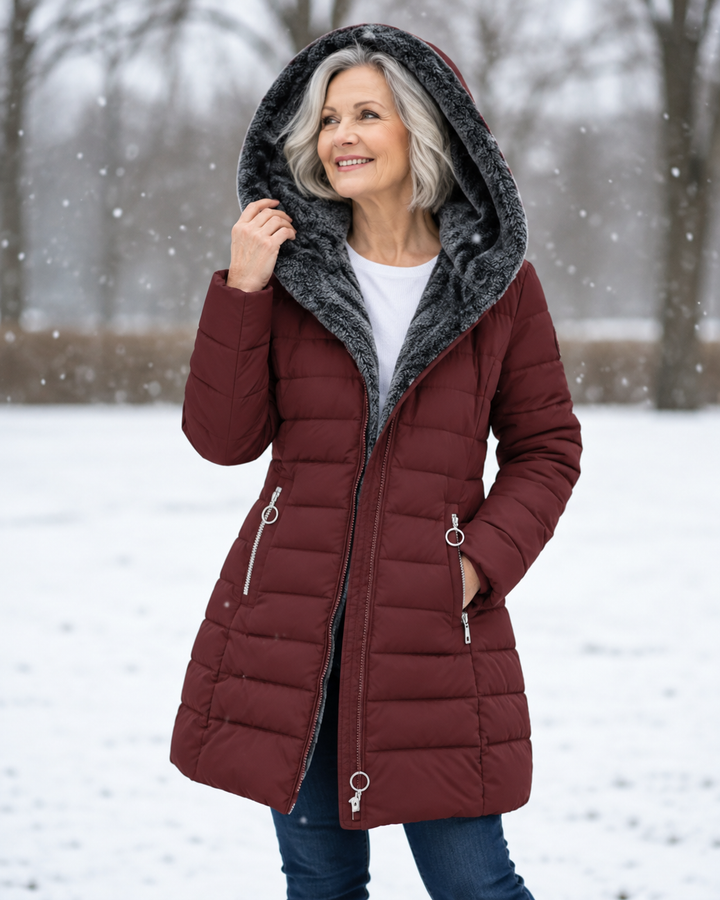 Women's winter coat with hood, burgundy quilted puffer, gray faux-fur hood lining, zipper front.