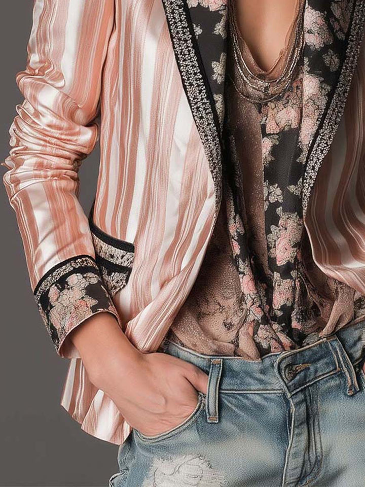 Pink satin-striped tailored blazer with black-trim cuffs and patterned lining near hem
