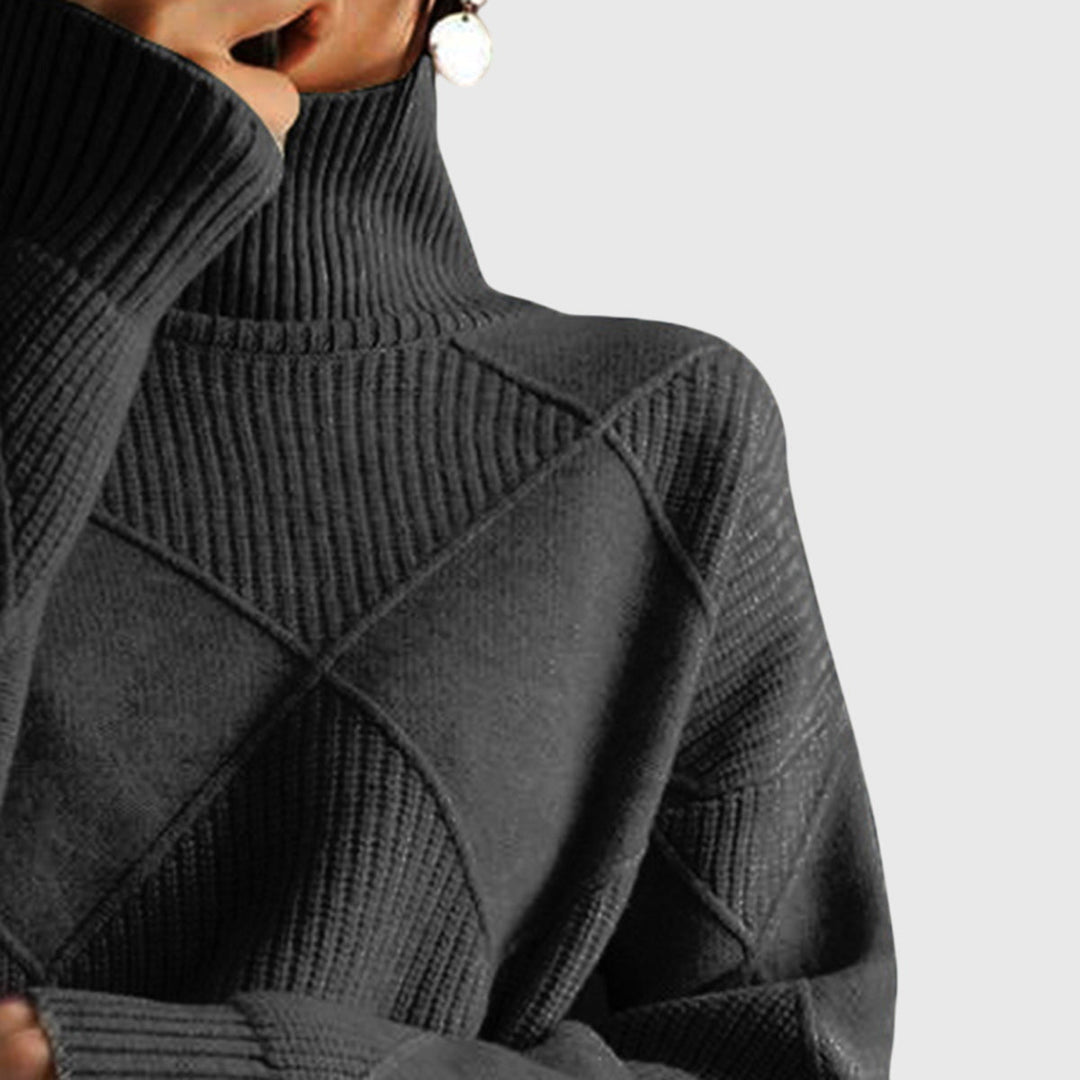 Black turtleneck jumper neckline close-up with ribbed collar and diamond motif