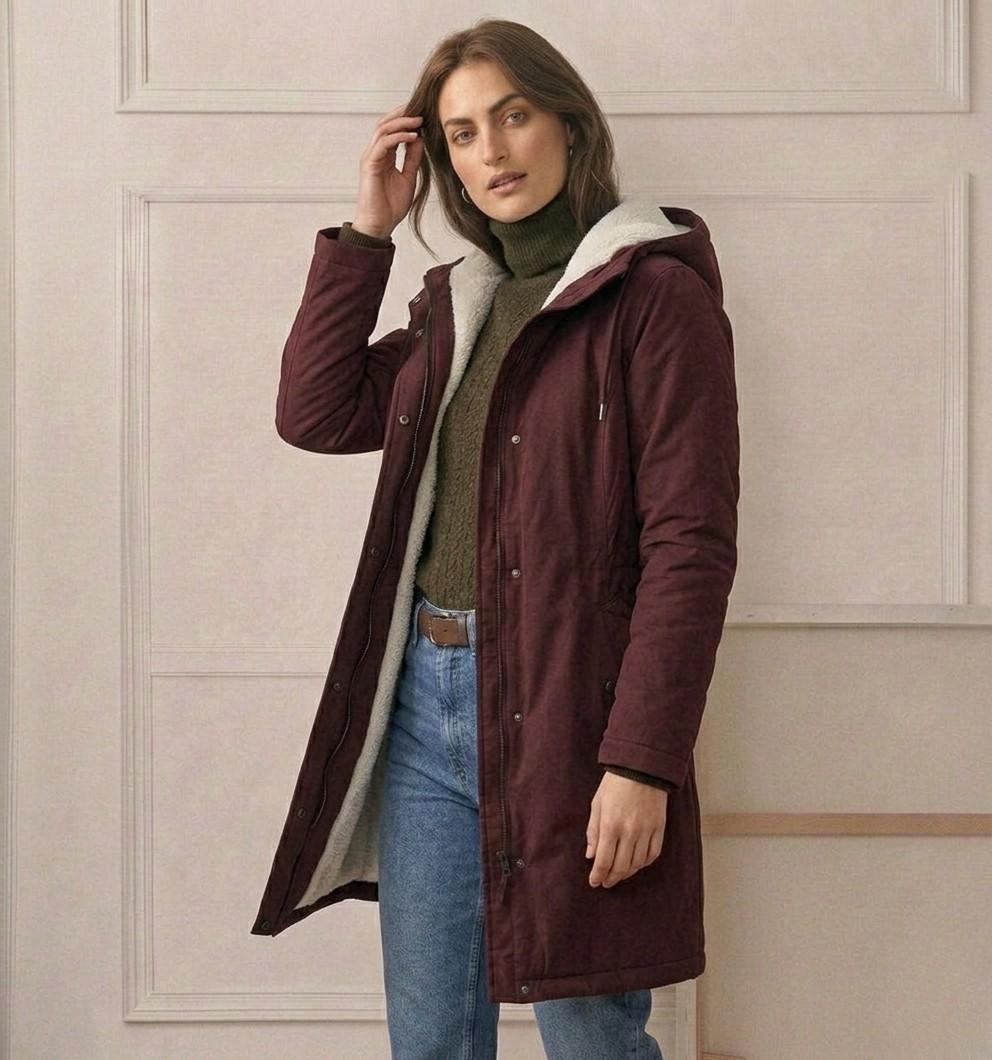 Waterproof long parka with hood, dark maroon outer shell, sherpa lining, front zipper.