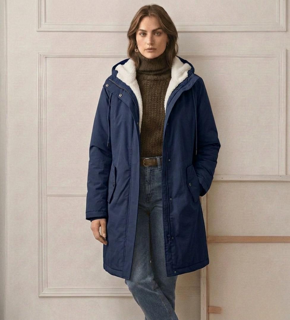 Navy waterproof long parka with sherpa hood lining, zip front, and two chest pockets