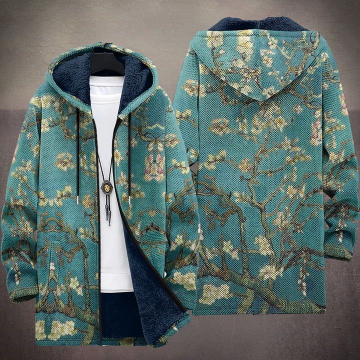 Multicolored patterned hooded cardigan with navy-lined hood, full back print, front zip