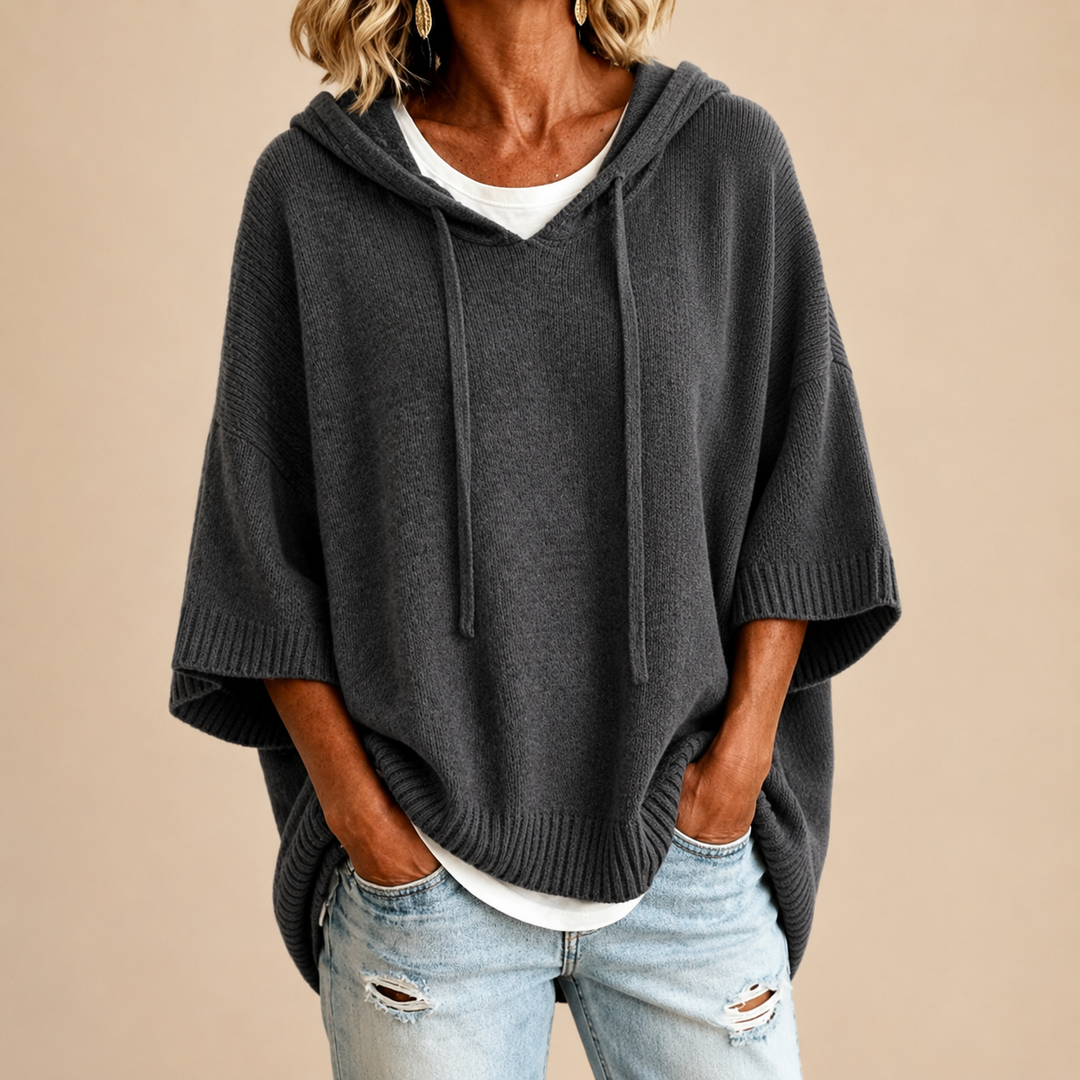 Gray knit poncho with hood, loose drape and wide sleeves