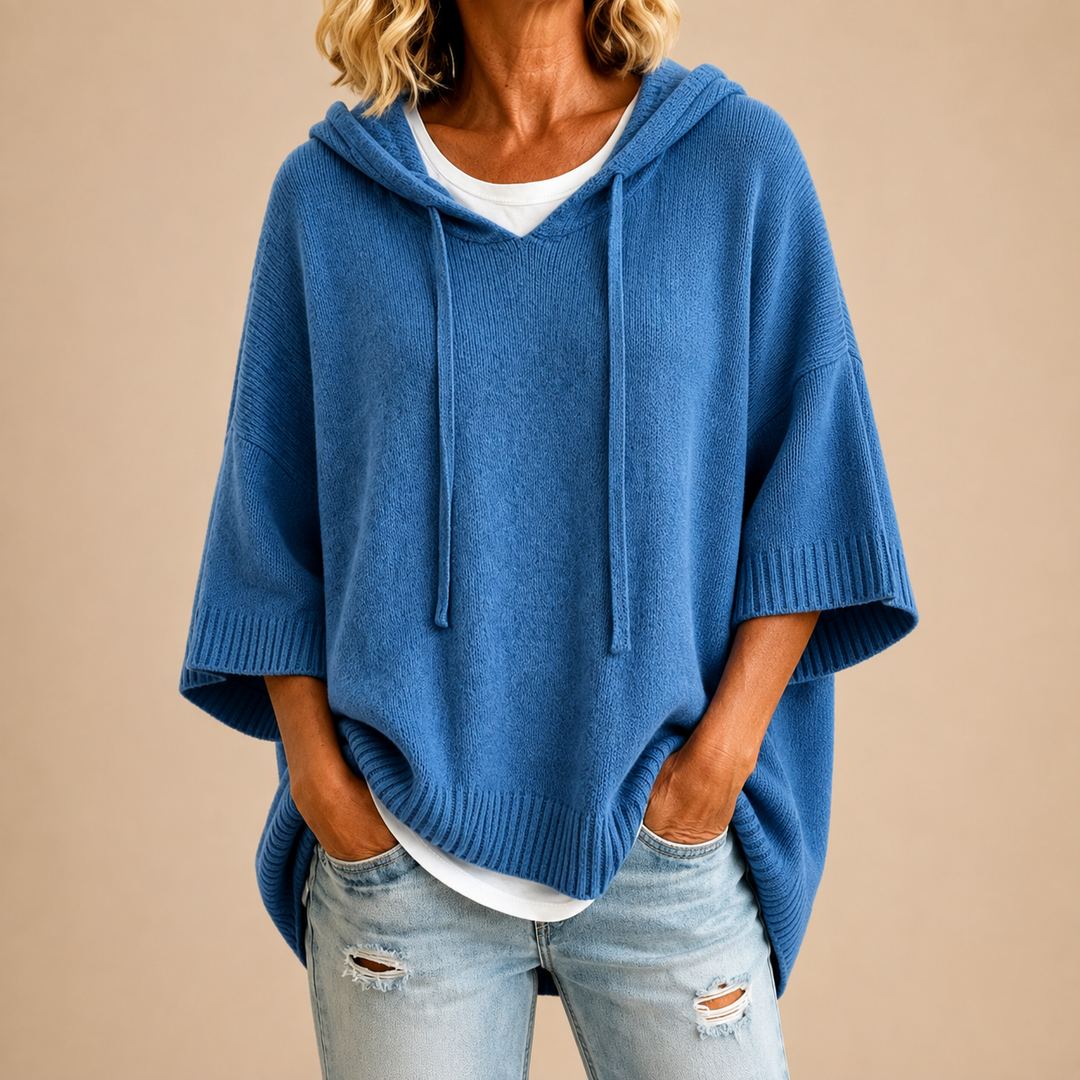 Blue knit hooded poncho with drawstring, loose fit and ribbed short sleeves
