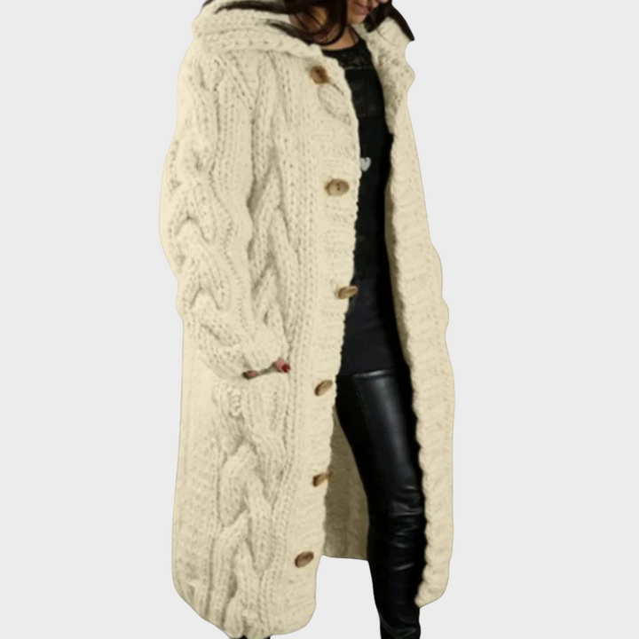 Cream cable-knit hooded cardigan with button front and twisted cable knit texture.