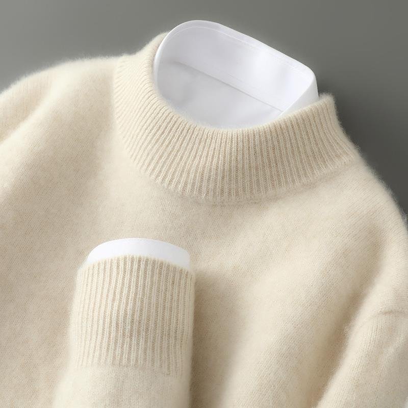 Cream cashmere turtleneck sweater close-up showing ribbed collar and cuffs