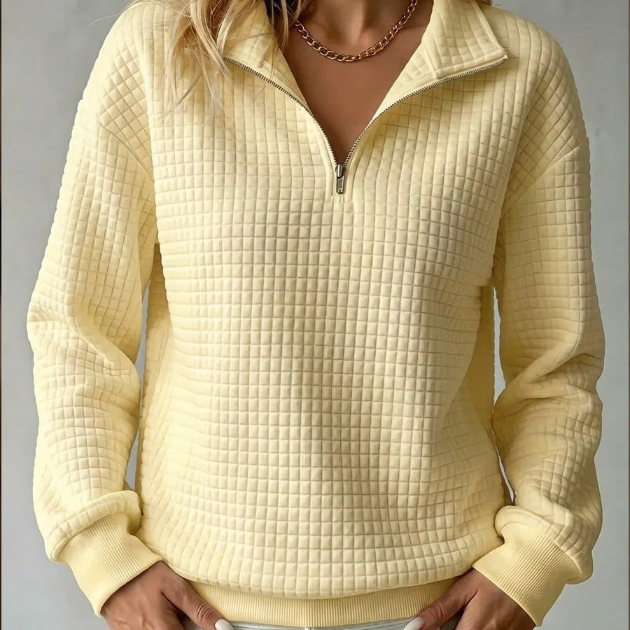 Yellow quilted quarter-zip sweater with zip front and ribbed cuffs and hem