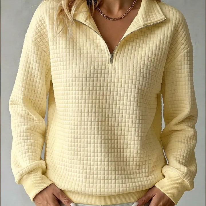 Yellow quilted quarter-zip sweater with zip front and ribbed cuffs and hem