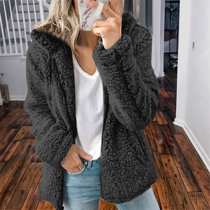Black hooded sherpa zip coat, worn style with full sleeves and front zipper