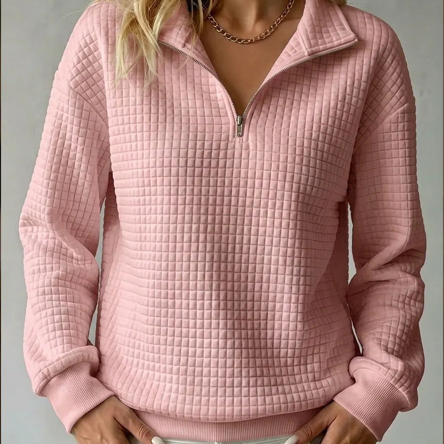 Pink quilted quarter-zip sweater with zip front and ribbed cuffs and hem