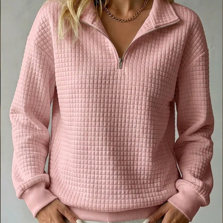 Pink quilted quarter-zip sweater with zip front and ribbed cuffs and hem