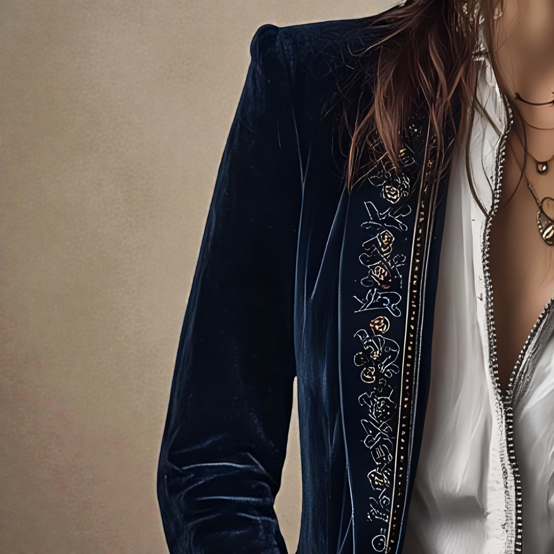 Midnight navy velvet blazer sleeve with ornate embroidered vertical trim detail