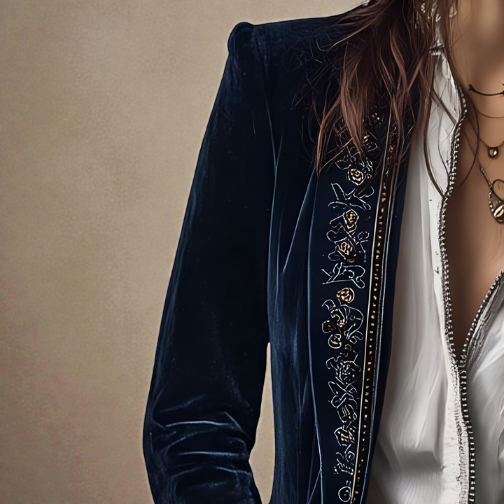 Midnight navy velvet blazer sleeve with ornate embroidered vertical trim detail