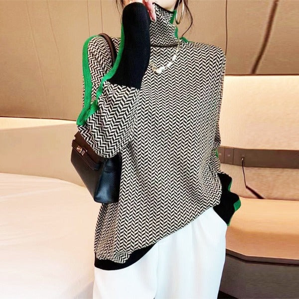 Chevron roll neck jumper worn with green-trimmed sleeves and black hem band