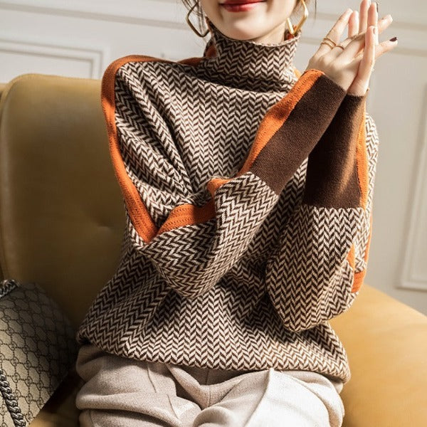 Women’s roll neck chevron knit with orange sleeve edges and chunky brown cuff trim