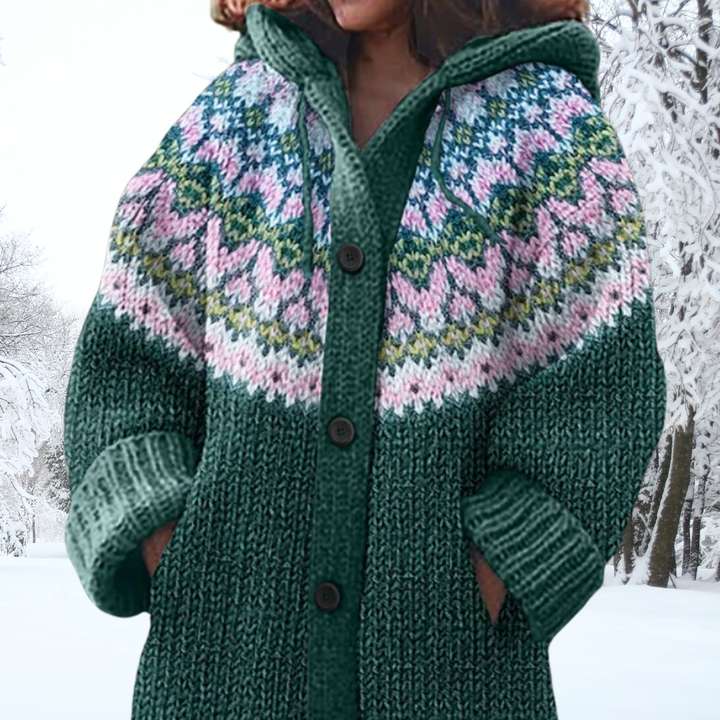 Green chunky knit hooded cardigan with dark buttons and pink/blue patterned yoke