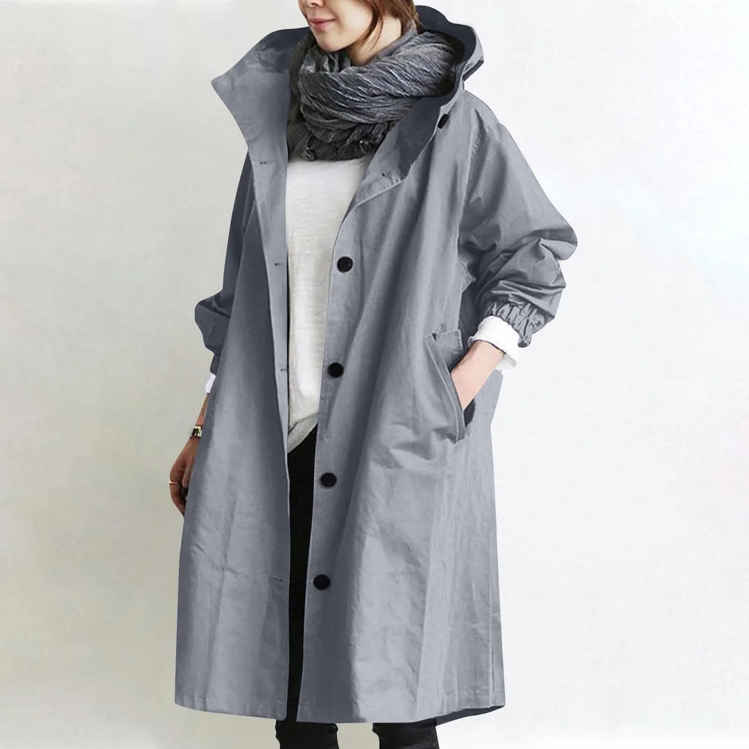 Hooded longline trench coat in light gray with double-breasted button front and hood