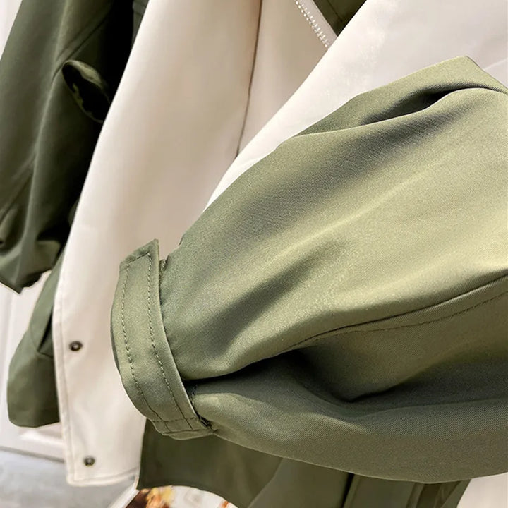 Olive green windbreaker sleeve with elastic cuff and white inner panel.