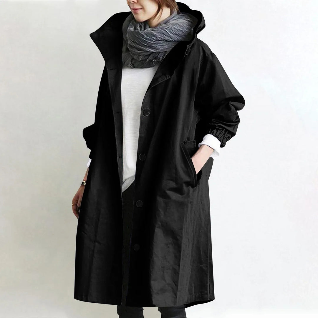 Hooded longline trench coat in black with double-breasted button front and hood