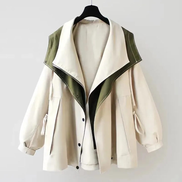 Two-tone windbreaker jacket in white and olive green, hooded with snap front.