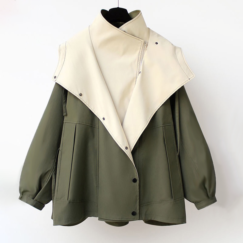 Green windbreaker jacket with cream hood lining and front snap placket